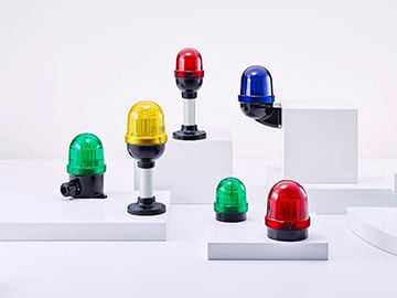 six beacons in different colours on a podest